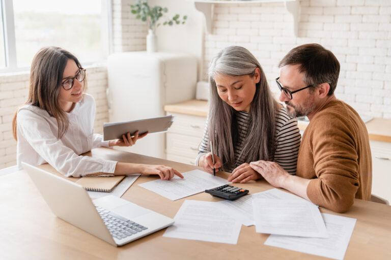 Financial advisor helping a family simplify financial complexity through coordinated wealth, tax, estate, and investment planning